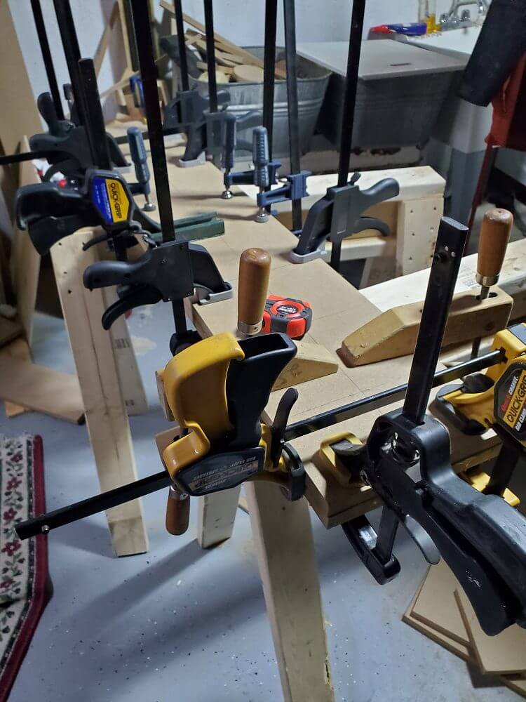 bunch of clamps gluing baffle